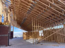 BLU-D framing at Hibbard Elementary, bottom of sheathed trusses to create roof